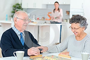 Retired couple playing cards