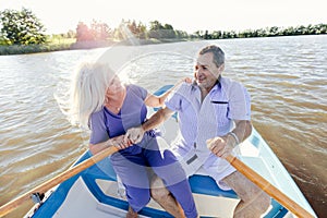 Retired couple spending time on a boat