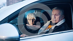 Retired couple testing new car. Winter vacation at old age
