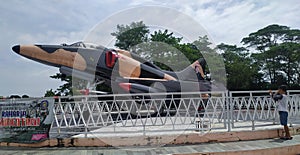 Retired and disused Hawk fighter jet at a playground in Indonesia