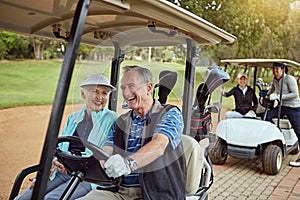 Retired and enjoying lifes small pleasures. a smiling senior couple riding in a cart on a golf course.