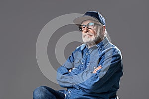 Retired high minded man resting on stool
