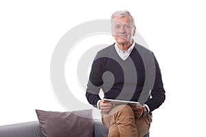 Retired man with digital tablet