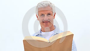 Retired man reading a book