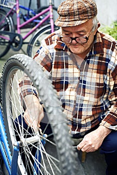 Retired man serviced bikes photo