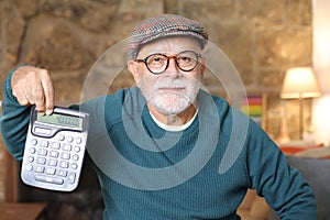 Retired man showing calculator result