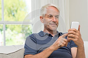 Retired man texting photo