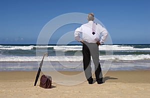Retired senior business man on beach vacation, copy space
