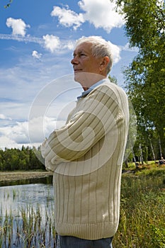 Retired senior by a lakeside