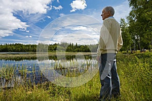 Retired senior by a lakeside