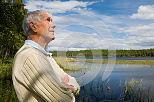 Retired senior by a lakeside