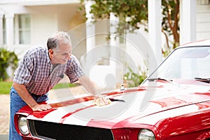 Retired Senior Man Cleaning Restored Car