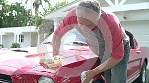 Retired Senior Man Cleaning Restored Car In Slow Motion