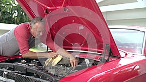 Retired Senior Man Working On Restored Car In Slow Motion