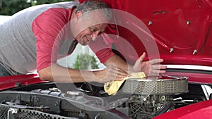 Retired Senior Man Working On Restored Car In Slow Motion