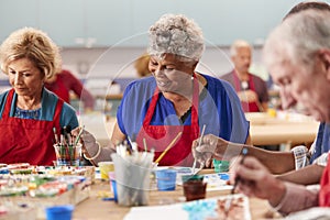 Retired Senior Woman Attending Art Class In Community Centre