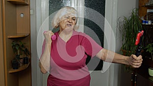 Retired senior woman doing workout, training, fitness, sport activity exercises during coronavirus