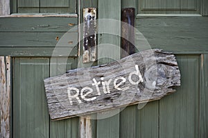 Retired sign on wooden door
