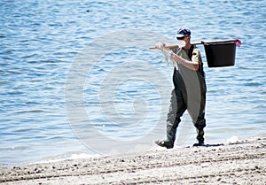 Retired volunteer seniors clean the Mar Menor, the Europe`s biggest salt water lagoon located in the south of Spain, during covid