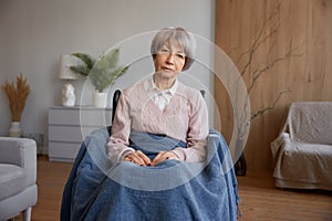Retired woman with disability sitting in wheelchair