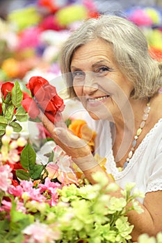 Retired woman with flowers