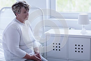 Retired woman in hospital room