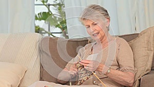 Retired woman knitting