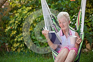 Retired woman reading photo