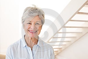 Retired woman smiling at the camera