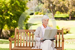 Retired woman working on her laptop