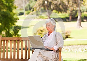 Retired woman working on her laptop