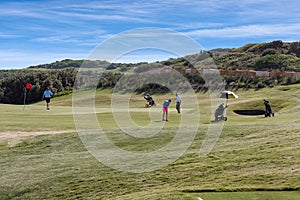 Retirees enjoying a social game of golf.