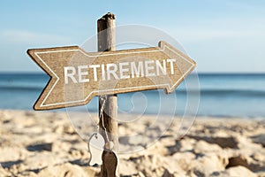 Retirement Directional Sign On Beach