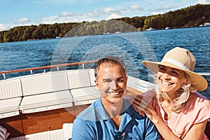 Retirement, here we come. Portrait of a mature couple enjoying a relaxing boat ride.