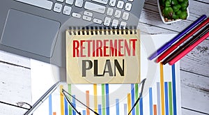 Retirement plan, written on a notepad with office tools,business