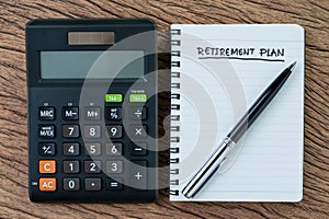 Retirement planning concept, calculator with empty notepad with