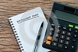 Retirement planning concept, calculator with empty notepad with