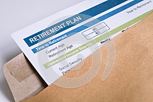 Retirement Planning letter in brown envelope opening