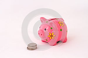 Retirement savings concept with piggy bank and coins