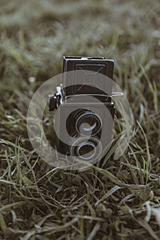 a retoro film camera on grass