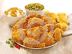 Retouched image of cruncy fried chicken meal