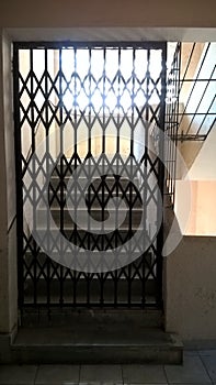 Retractable sliding doors made of iron bars for security purpose