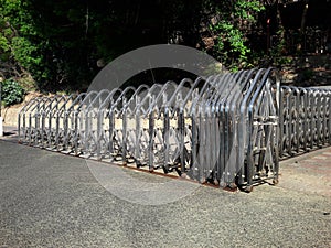 Retractable Stainless Steel Barrier Fence with Casters installed as a temporary fence, ready for use.