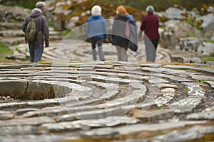 retreat attendees walking a stone labyrinth in silence