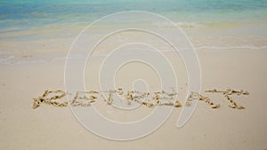 Retreat Text Written On Sand Near The Idyllic Sea