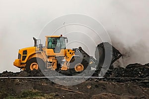 Retrieval of coal mining products with heavy equipment
