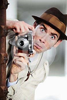 Retro agent man, street and camera for investigation, inspection and spy job in city with surprise face. Private