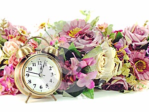 Retro alarm clock with flowers on white background