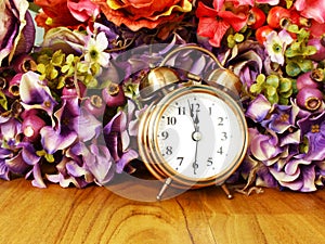Retro alarm clock with flowers background