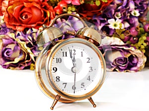 Retro alarm clock with flowers background